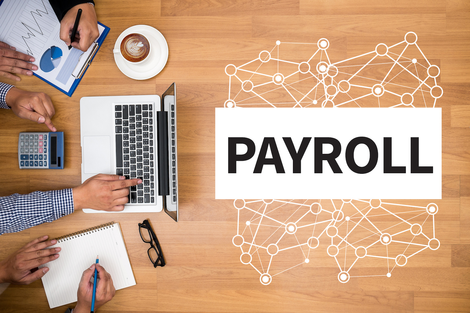 PAYROLL Business team hands at work with financial reports and a laptop